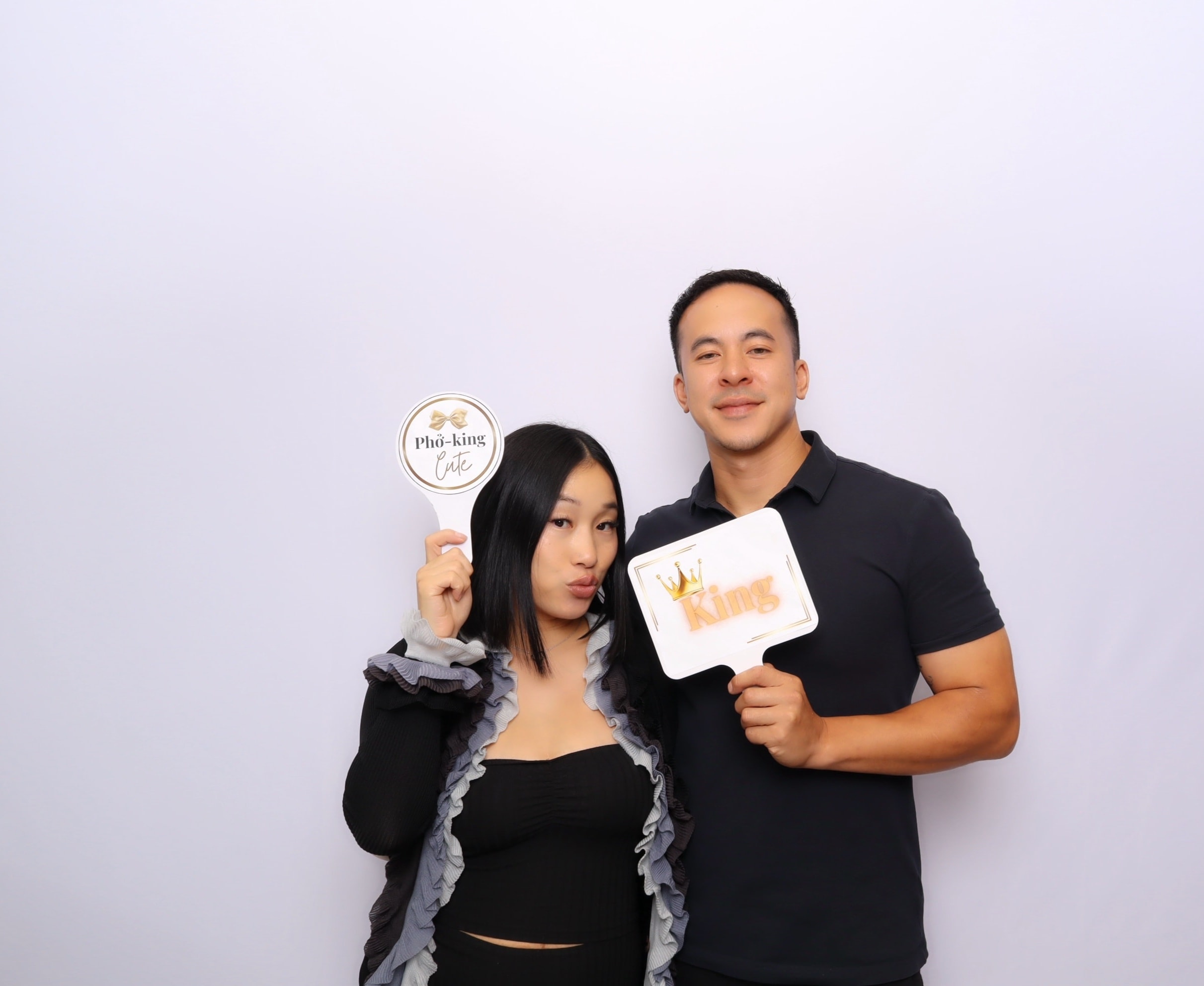 Couple posing with celebration signs
