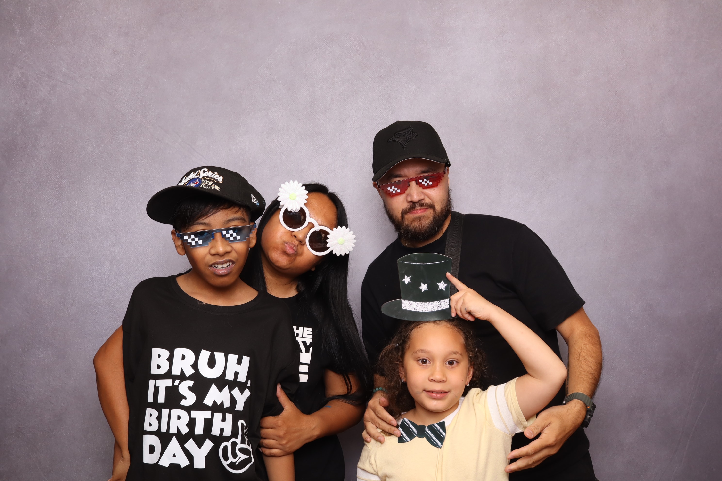 Family celebrating at a photo booth