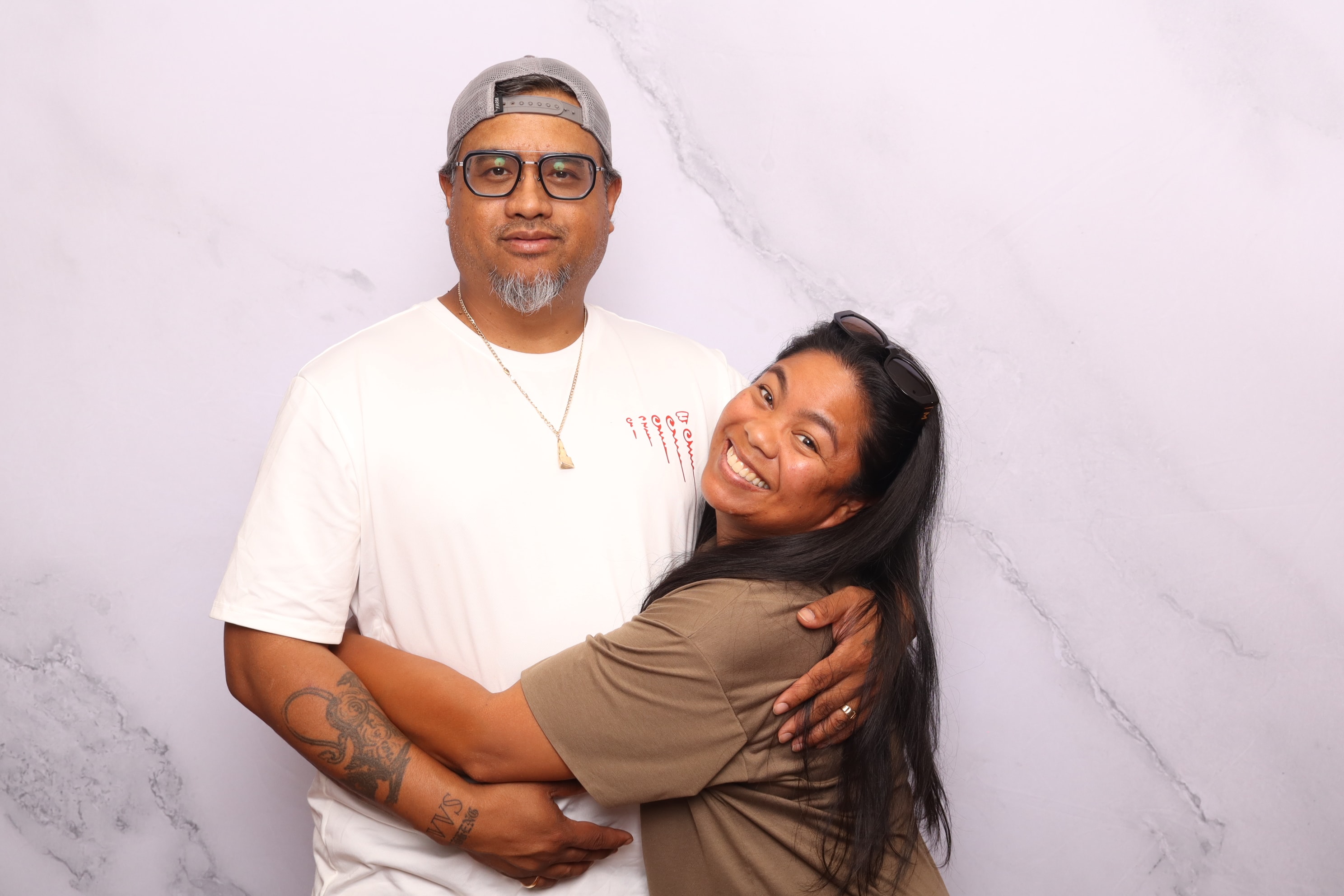 Couple embracing at a photo booth